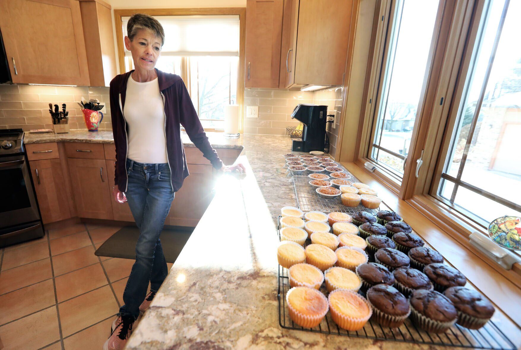 Michelle Ogilvie in the kitchen with muffins